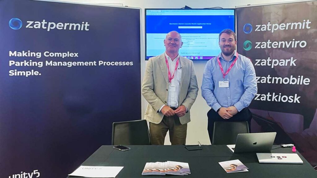 James West and Neil Parker at UHEI 23 London - standing in front of the Zatpermit stand - making complex business processes simple