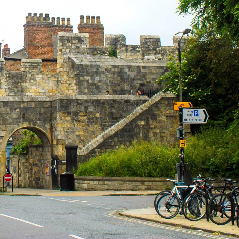Bicycles parked outside York city gate